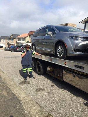 Brent with my Pacifica loaded onto his tow truck.