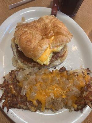 Breakfest croissant w Hashbrowns w onions and cheese