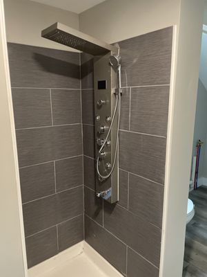 Tiled shower with shower tower