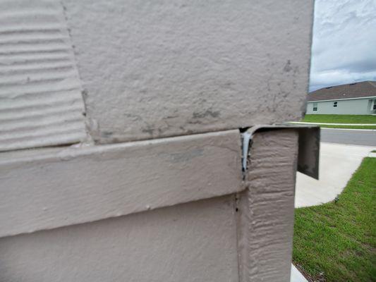 improper flashing and cracked smashed corner post