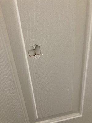 Just moved in and there's a hole in our door