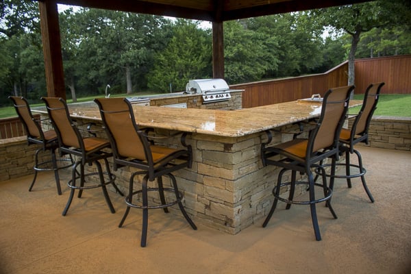 Wrap-around granite countertop designed and installed by Red Valley Landscape & Construction in Norman, Oklahoma.