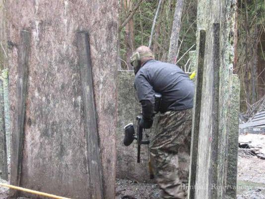 Young Man behind paintball bunker.  more photos https://www.facebook.com/MonkeyTimePaintball