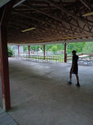 Large covered patio overlooks small pond for events