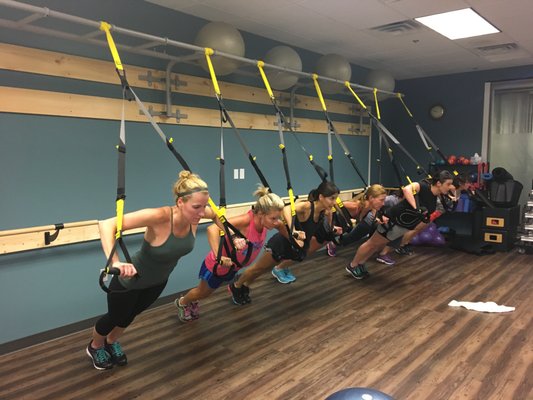 Boutique Studio Classes, including TRX, barre, and Pilates reformer.