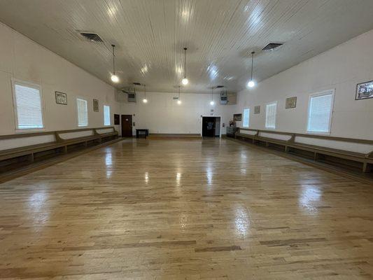 Shiny dance floor/event space post cousin mop job.