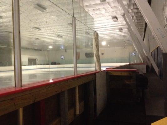 Player boxes opposite bleacher side.