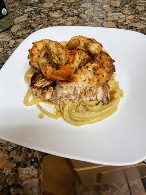 Honey glazed salmon with grilled shrimp Alfredo pasta.