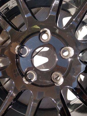 Steel inserts. Lug nuts will cover the raw aluminum