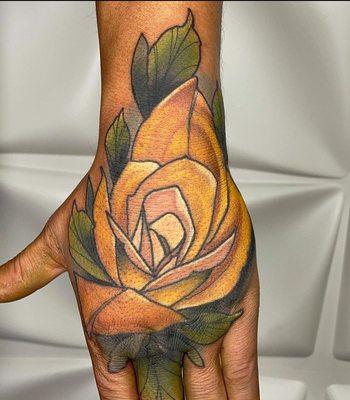 Neotraditional rose hand tattoo by Josh Moon