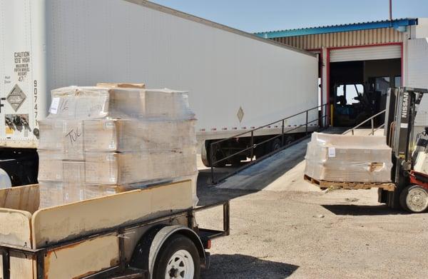 Loading pallets in my trailer for the last five miles of their journey.