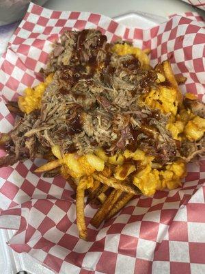 Special of pulled pork over Mac and cheese