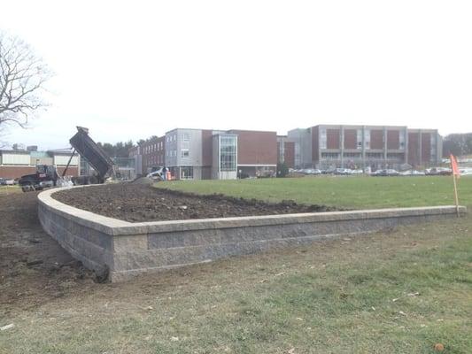 Construction of Retaining wall and warning track at Reading High school for the Reading Little League baseball field...