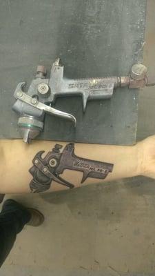 Spray gun tattoo, by Nick Maki