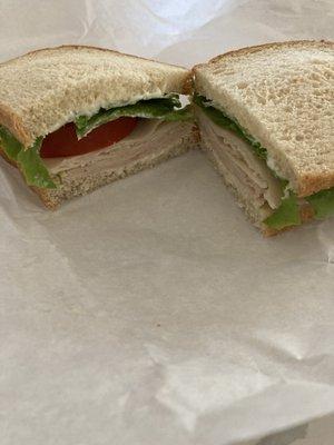 Deli sandwich with turkey, lettuce, tomato, Mayo on sourdough