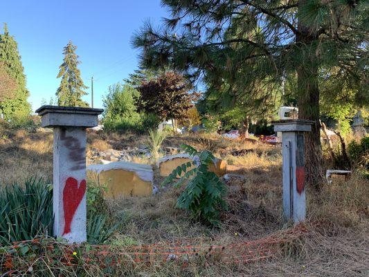 Abandoned and trashed lot with needles and homeless encampment owned by Thomas James Homes