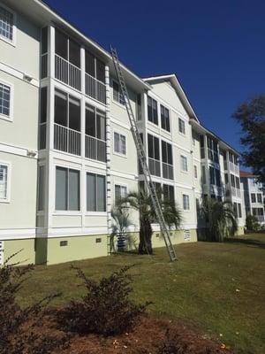 Inspecting a 3 story roof on a beautiful apartment complex.