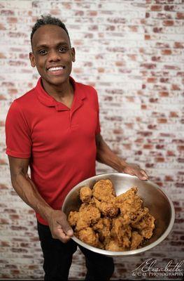 Founder and CEO Felix Miranda proudly showcasing his original crunchy and delicious chicken.