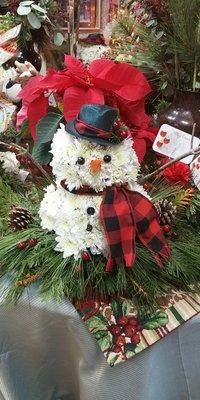 Snowman made out of fresh cut flowers