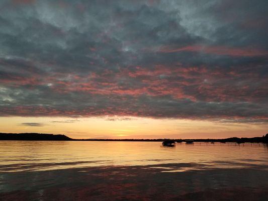 Sunset view from the beach outside our Glen Lake cottage rental. Thanks Visit Up North!