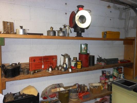 Lots of great oil cans, tools, and lamps. A garage full of treasures.