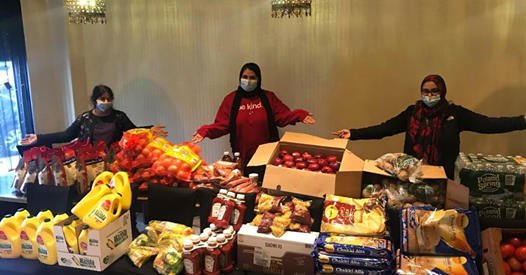 Volunteers packing up supplies purchased with donations