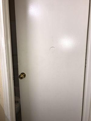 Hole in bathroom wall