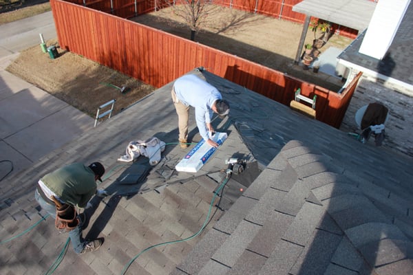 Infinity Roofing installing 25 yr shingles.