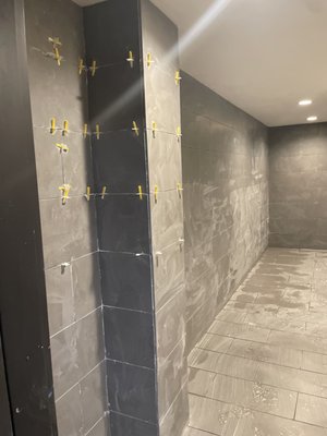 Full wall and floor tiling