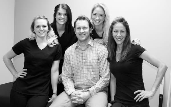 Dr. Nick with his massage therapists and business partner!