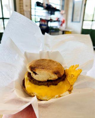 Sausage, egg, and cheese breakfast sandwich on English muffin.