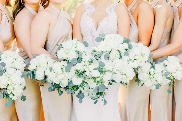 white roses and eucalyptus bride and bridesmaids bouquets