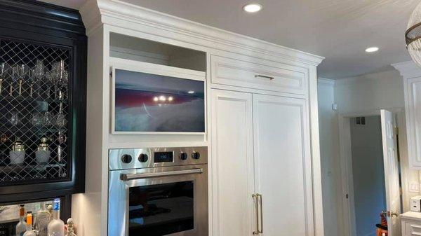 Client asked for a TV in the kitchen but it had to be discrete. 32" Frame TV and all the components are hidden behind the TV