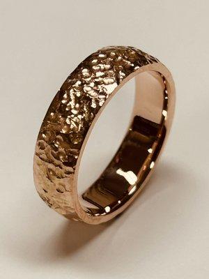 Handmade hammered wedding ring in 14 karat rose gold made by master jeweler Berj B.