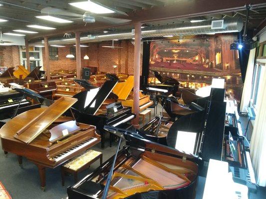 Our showroom features nearly 100 new and beautifully restored upright, grand, player, digital, and digital hybrid pianos.