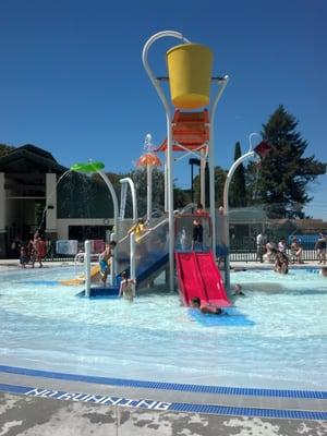 Water play structure in wading pool area. Very small kid friendly!