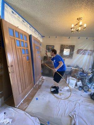 Clear coating freshly stained doug fir custom doors