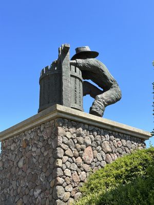 Winemaker sculpture on vineyard trail