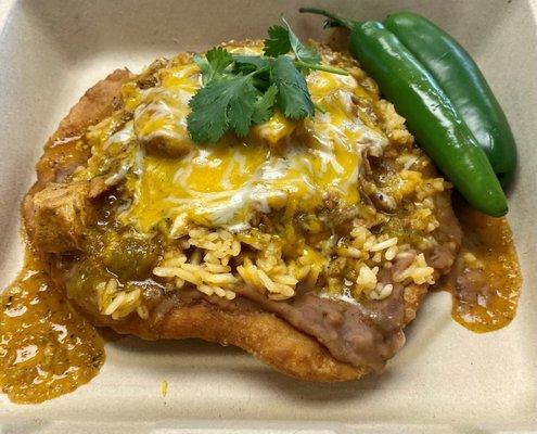 Fried Tostada
 Fried Bread topped with, Beans, Rice, Cheese and Chili Verde! Yum!!