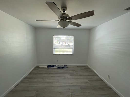 Bedroom painting, flooring installation and ceiling fan installation