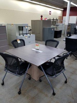 Square conference table for small spaces.