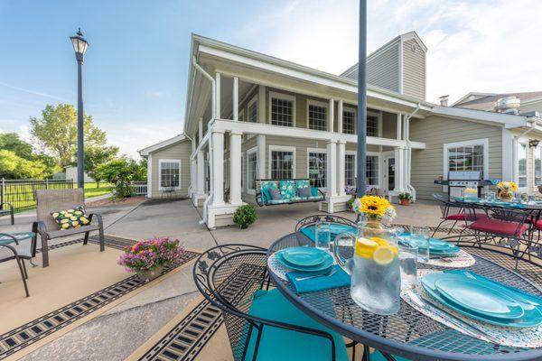 Spacious patio with swing and outdoor dining area