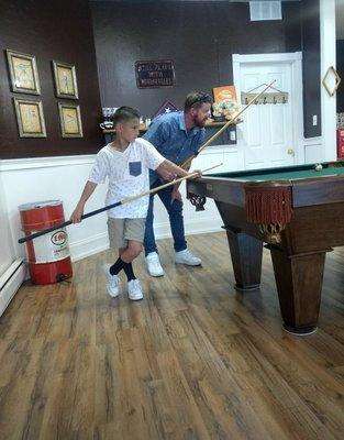 Styling with a haircut and game of pool