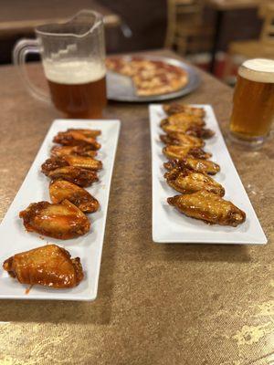 On the left you have Mild wings and Mango Habanero on the right. Medium Pepperoni in the background.