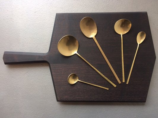 Hand forged Japanese brass spoons on Edgewood cutting board.