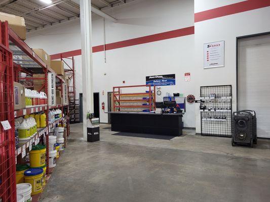 Interior service desk and shelves at Jon-Don Boston