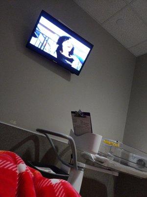 Waiting room with tv inside the birthing suite