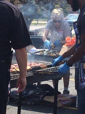 The Evanston Police department cooking burgers off the grill.