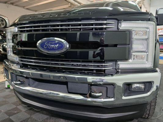 Ford F350 chrome grill delete with black metallic PPF.