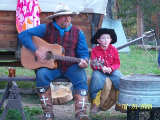 One of the littlest wranglers with his dad as we had a sing-along.